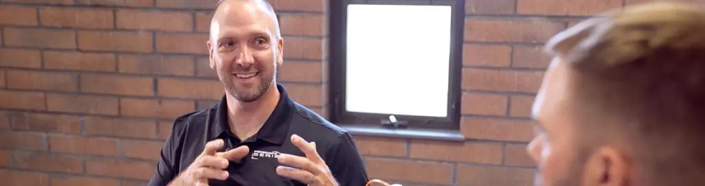 Ken & Chad talking in the conference room