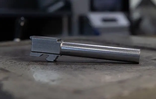 Finished Pistol Barrel on Wood Workbench